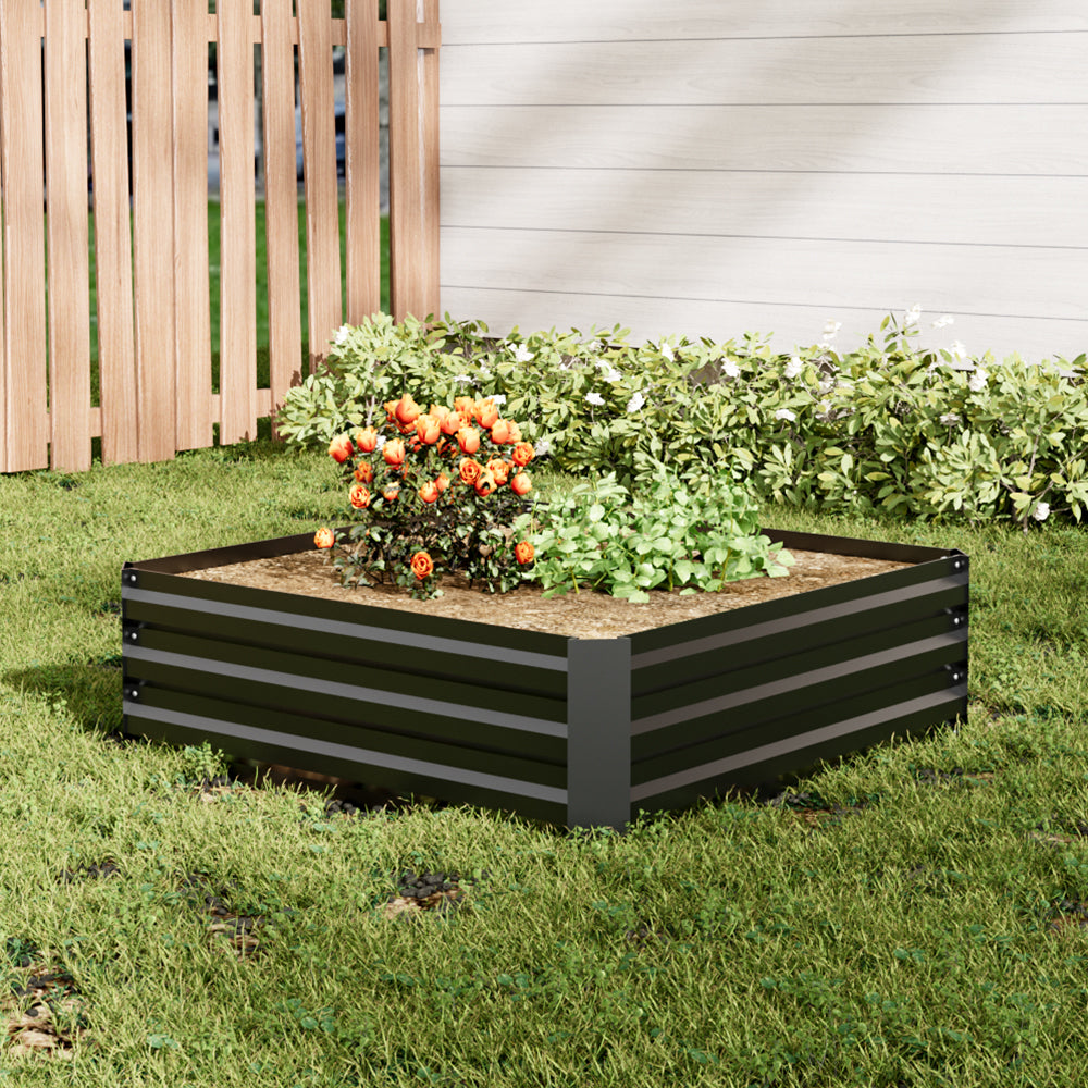 Wide shot of Medium Black Galvanized Steel Square Raised Garden Bed in a well-maintained backyard garden