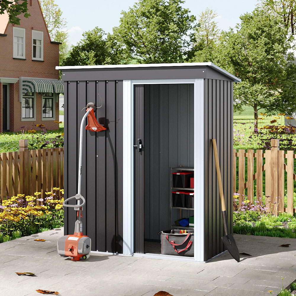 Charcoal black 6x3ft metal shed with open door – garden scene showing tool organization and interior space