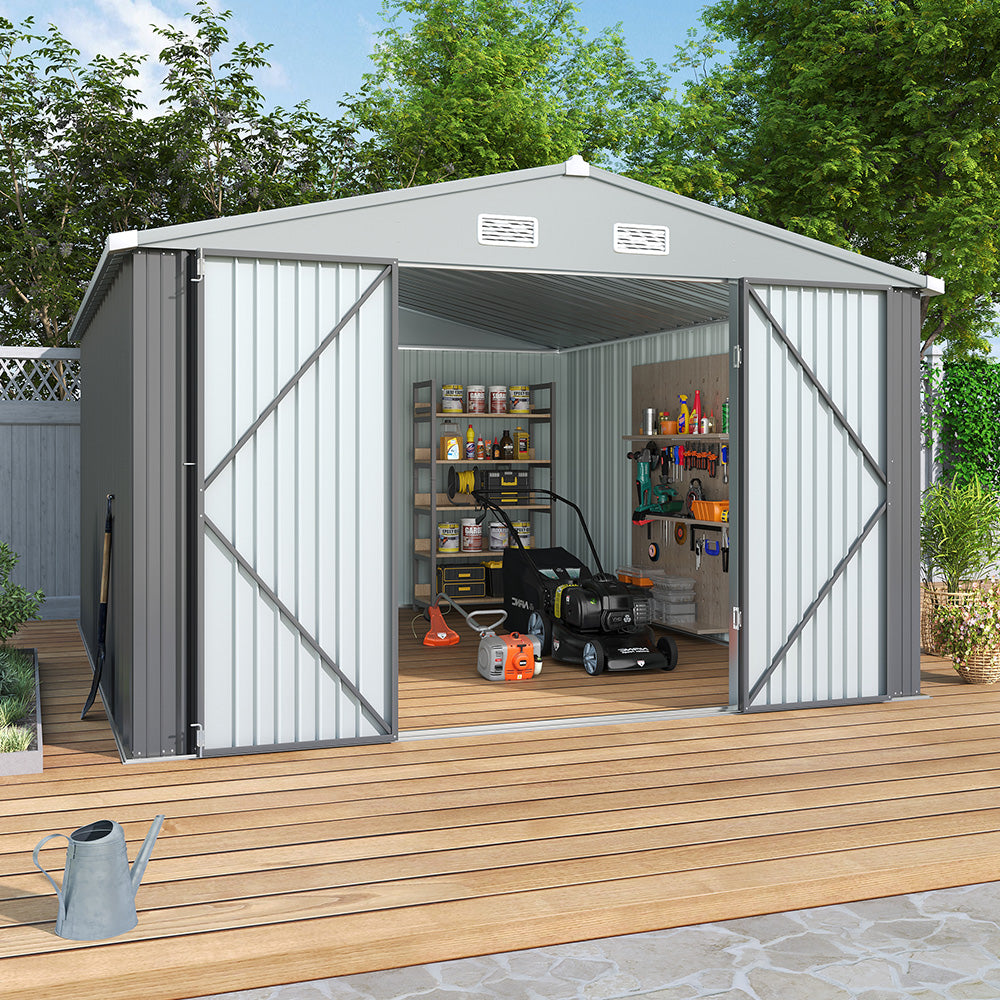 Spacious 10x12ft steel apex shed placed on garden flooring, open doors revealing interior tool storage by fence wall