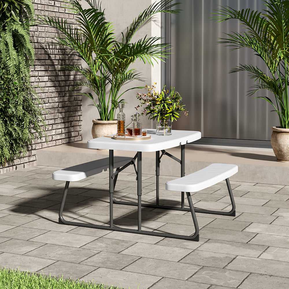White Foldable Picnic Table Set in Garden – Perfect for Outdoor Meals and Gatherings