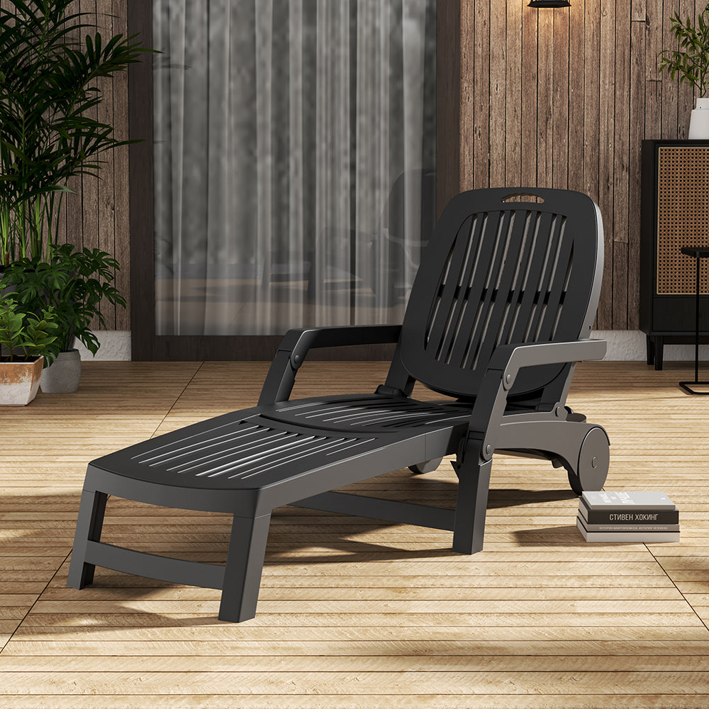 Black outdoor folding chair in shaded garden – relaxing setup
