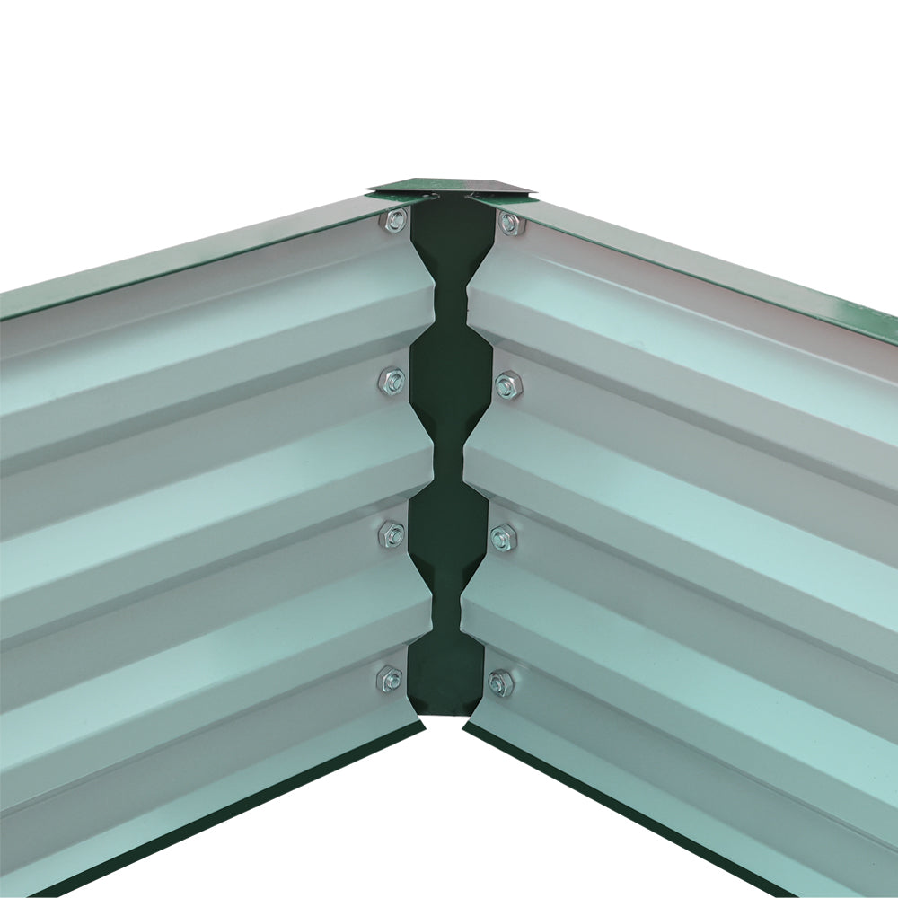 Detail of internal corner of dark green metal garden raised bed – durable design for secure planting