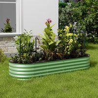 Light green oval raised garden bed in garden – ideal for growing plants, herbs, and vegetables outdoors