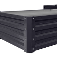 Close-up of exterior corner of charcoal black L-shaped garden raised bed – robust metal frame and weather-resistant coating